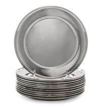 A Set of Eleven American Silver Bread Plates, Mid 20th Century, plain circular form with upturned rims.