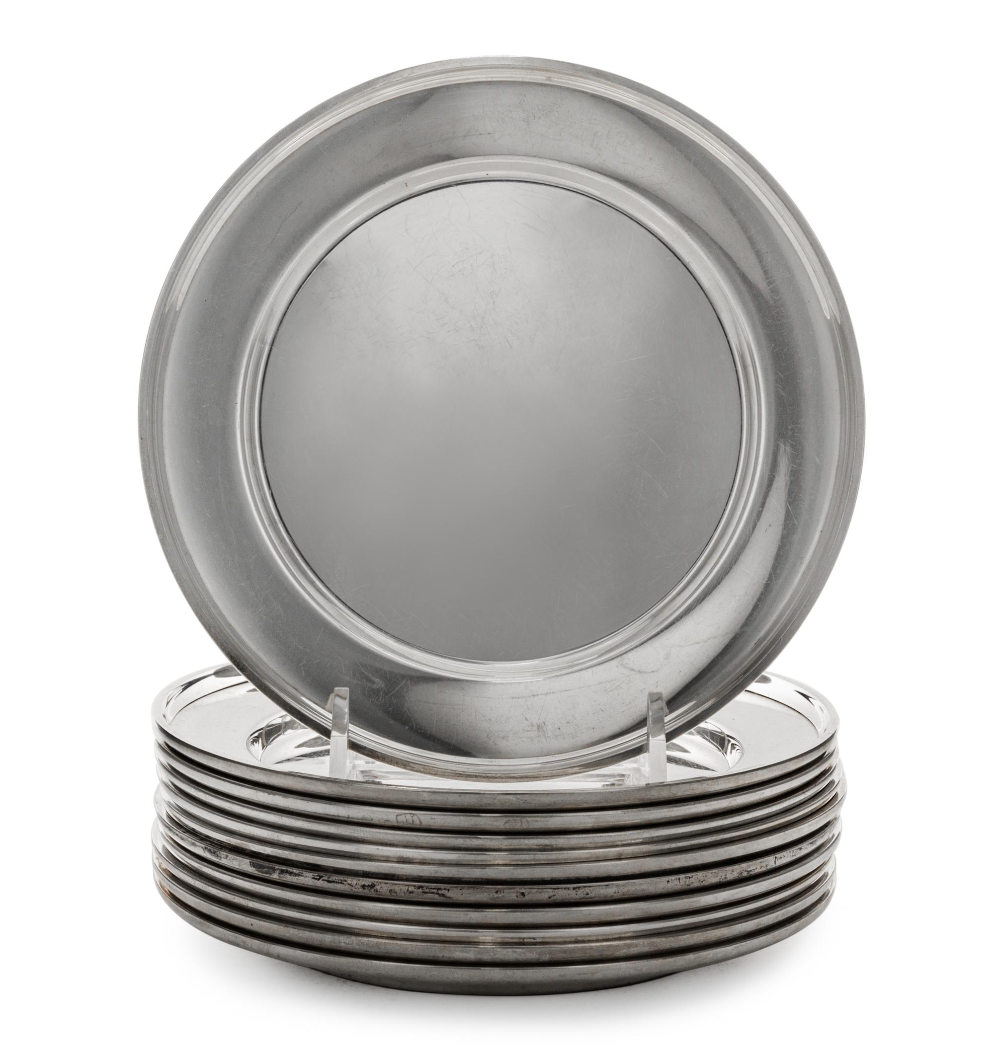 A Set of Eleven American Silver Bread Plates, Mid 20th Century, plain circular form with upturned rims.