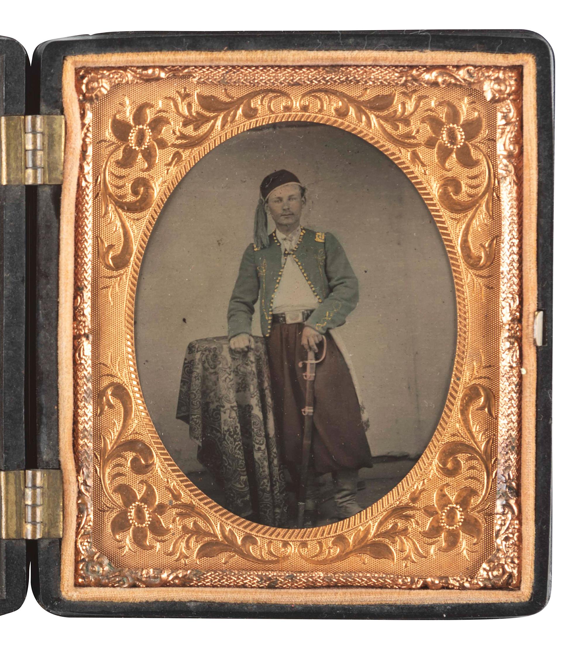 [CIVIL WAR]. Sixth plate hand-colored tintype of a Zouave officer posed with his sword.