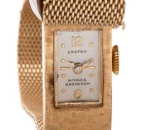 Croton, Nivada Grenchen, 14K Yellow Gold and Diamond Buckle Surprise Watch