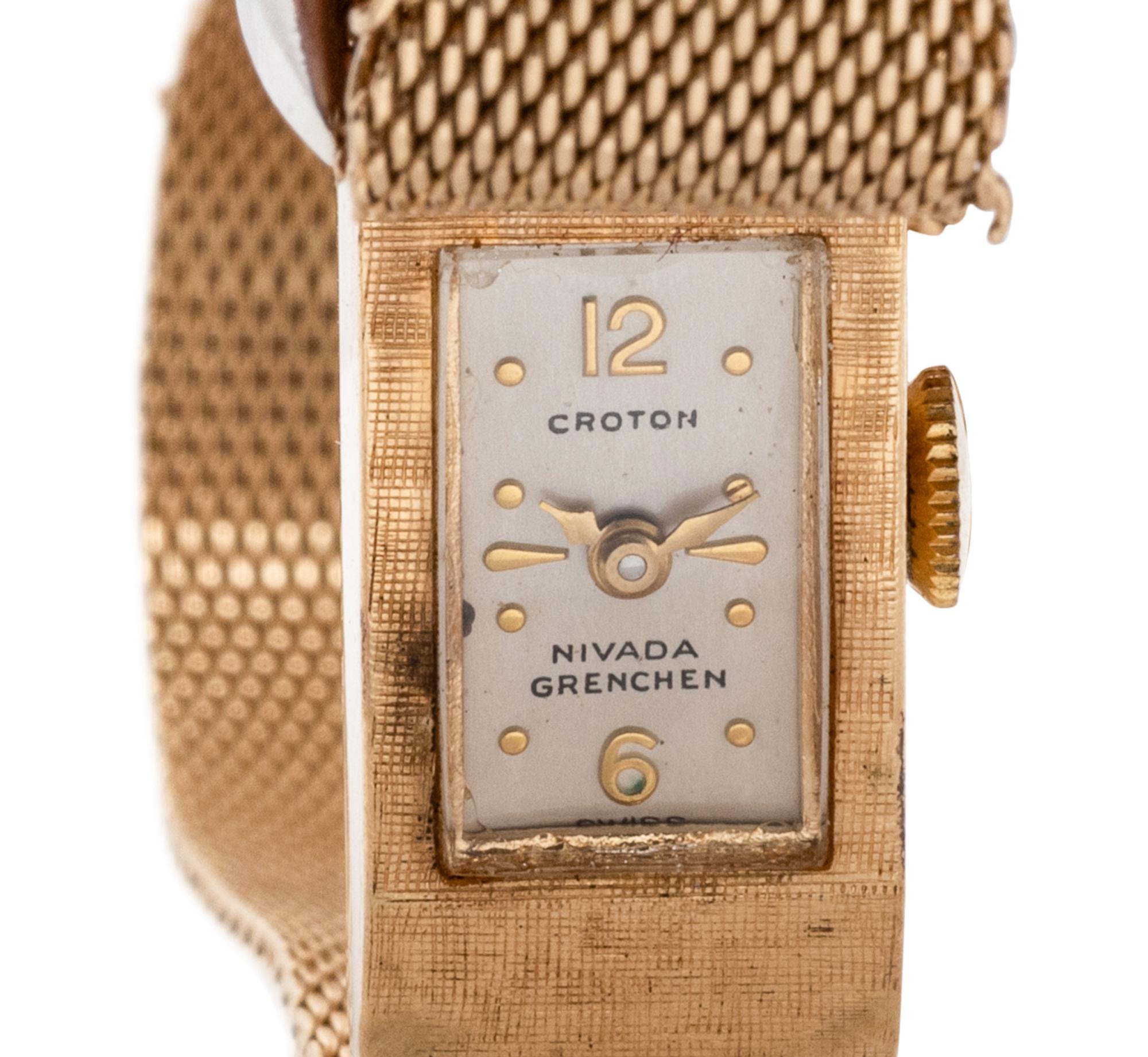 Croton, Nivada Grenchen, 14K Yellow Gold and Diamond Buckle Surprise Watch