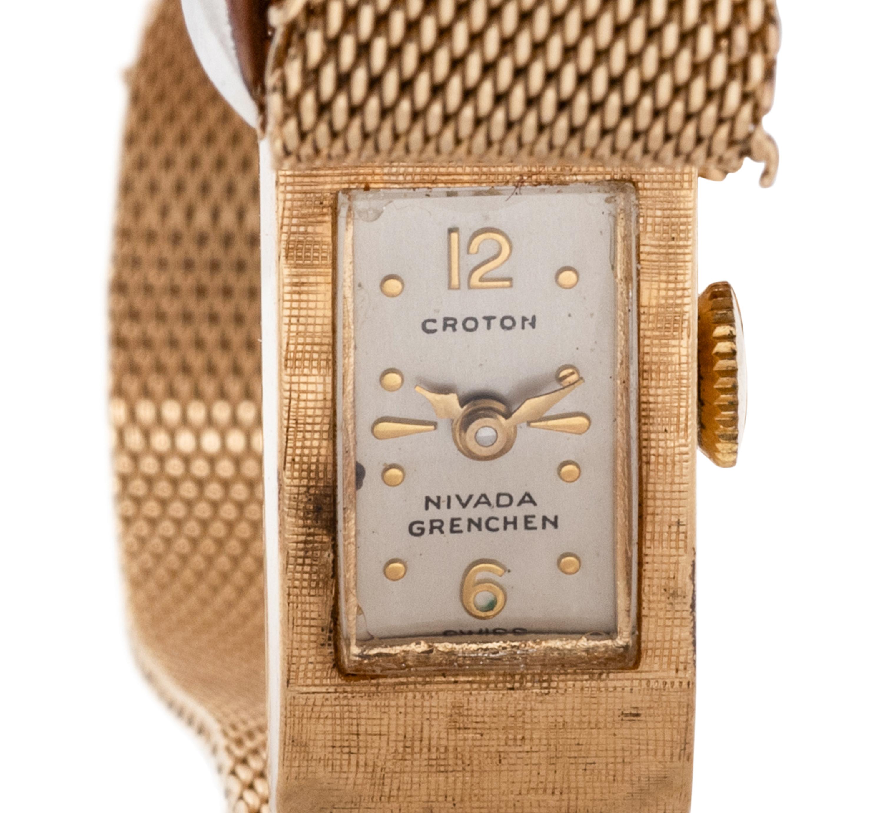 Croton, Nivada Grenchen, 14K Yellow Gold and Diamond Buckle Surprise Watch