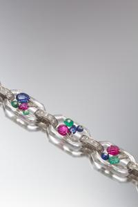 An Art Deco Platinum, Gold, Rock Crystal, Diamond and Multi Gem Tutti Frutti Bracelet, Cartier, 17.00 dwts.