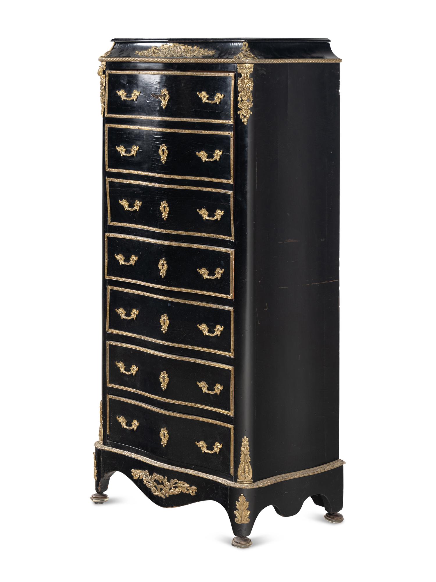 A Napoleon III Style Gilt Bronze Mounted Ebonized Semainier