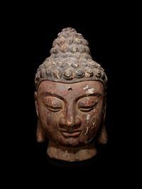 A Carved Wood Head of Buddha