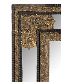 A Dutch Pressed Brass and Part Ebonized Mirror