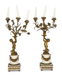 A Pair of French Gilt Bronze and Alabaster Three-Light Candelabra