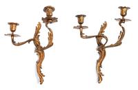 A Pair of Louis XV Style Gilt Metal Two-Light Sconces Height 12 inches. — 20TH CENTURY