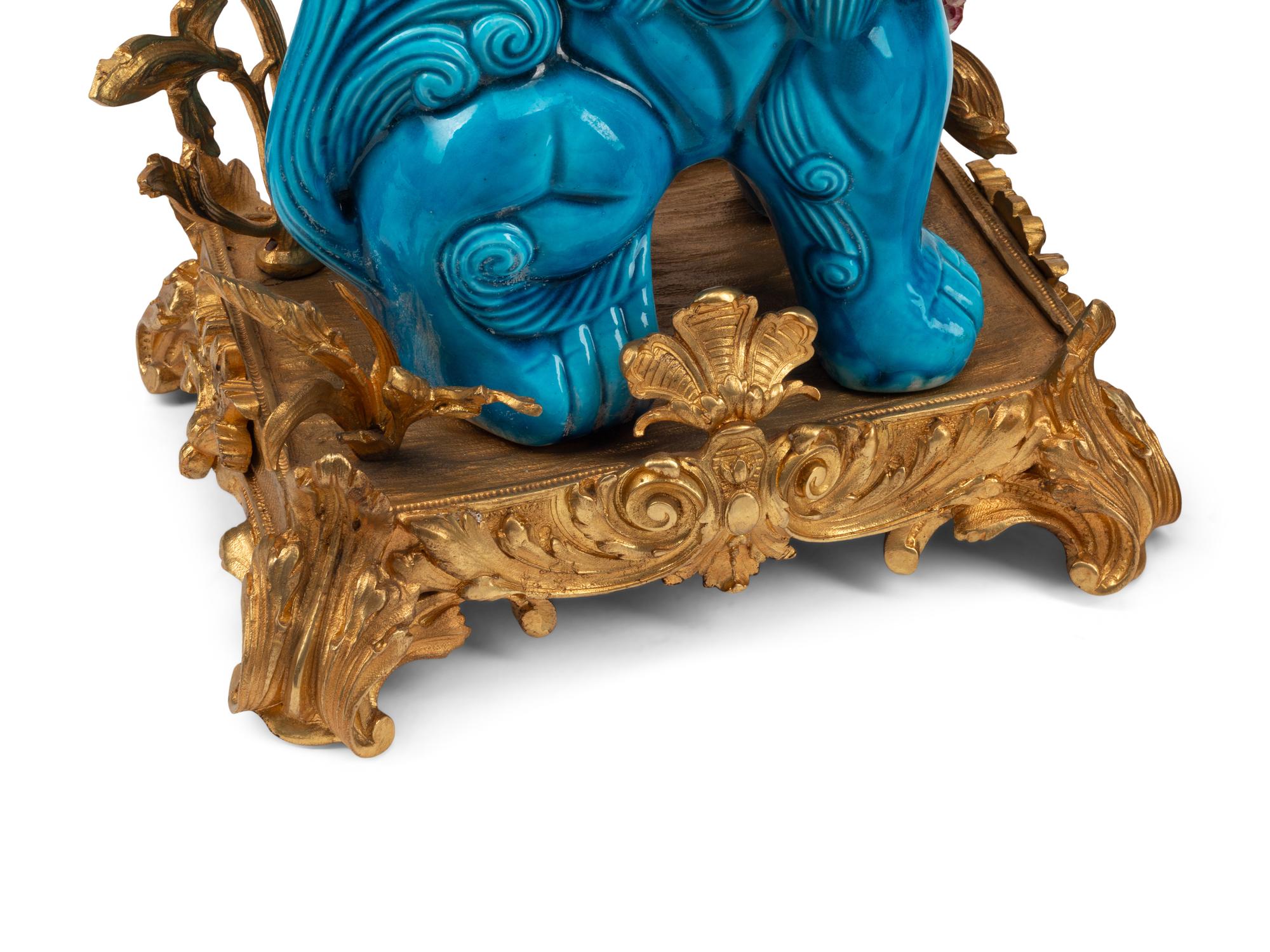 A Pair of French Gilt Bronze Mounted Turquoise Glazed Porcelain Guardian Lion Candelabra