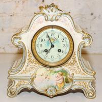A Continental Porcelain Mantle Clock. Height 11 inches.