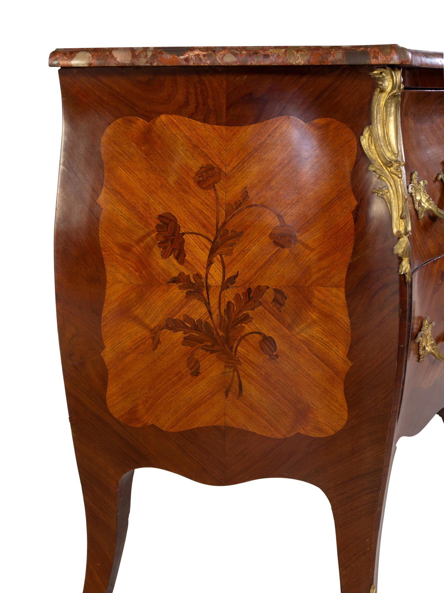 A Louis XV Style Gilt Bronze Mounted Kingwood and Sans Traverse Marquetry Marble-Top Bombe Commode