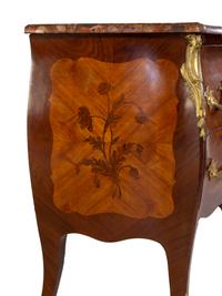 A Louis XV Style Gilt Bronze Mounted Kingwood and Sans Traverse Marquetry Marble-Top Bombe Commode