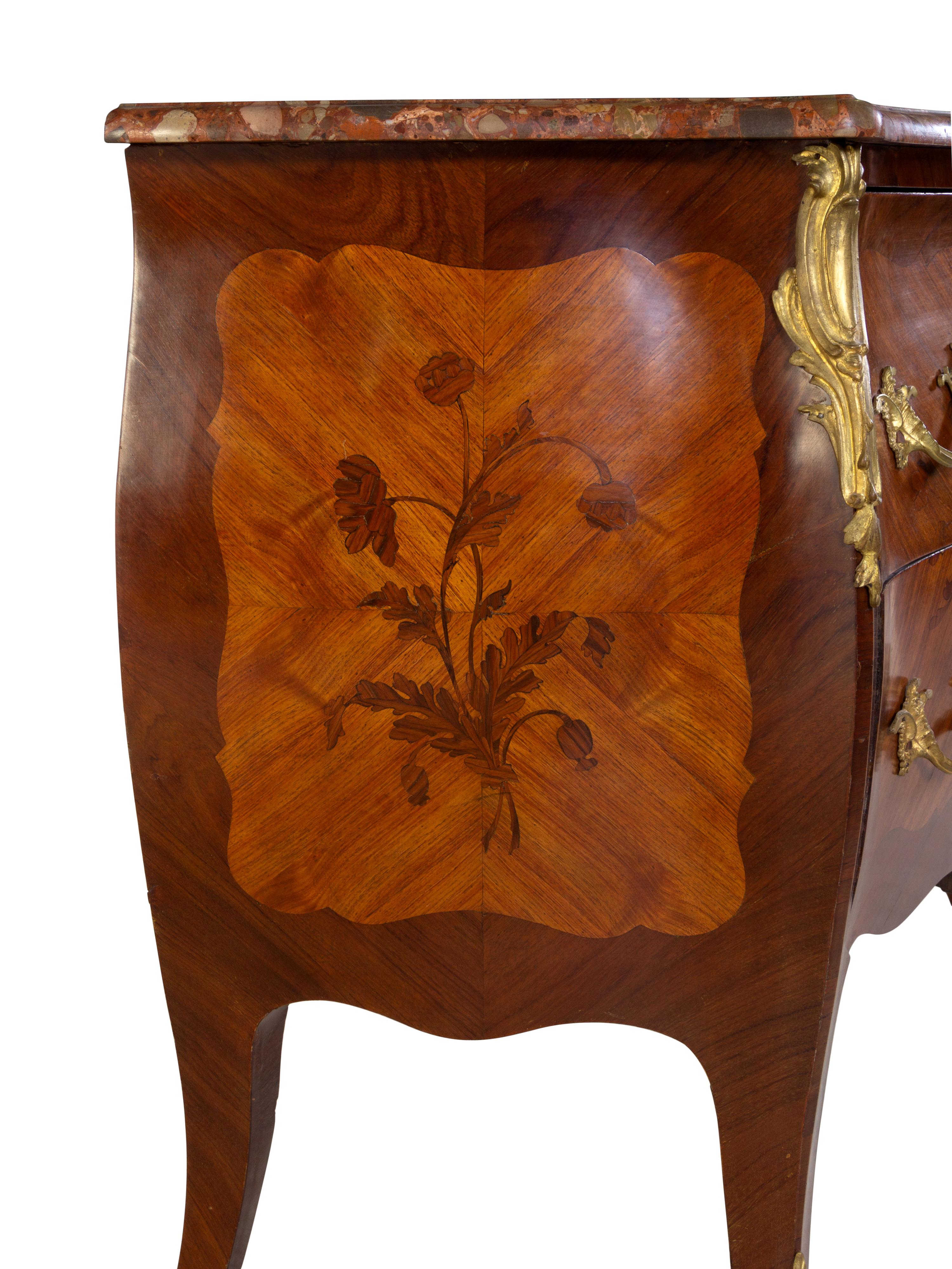 A Louis XV Style Gilt Bronze Mounted Kingwood and Sans Traverse Marquetry Marble-Top Bombe Commode