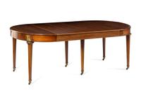 A Louis XVI Style Gilt Metal Mounted Walnut and Marquetry Extension Dining Table