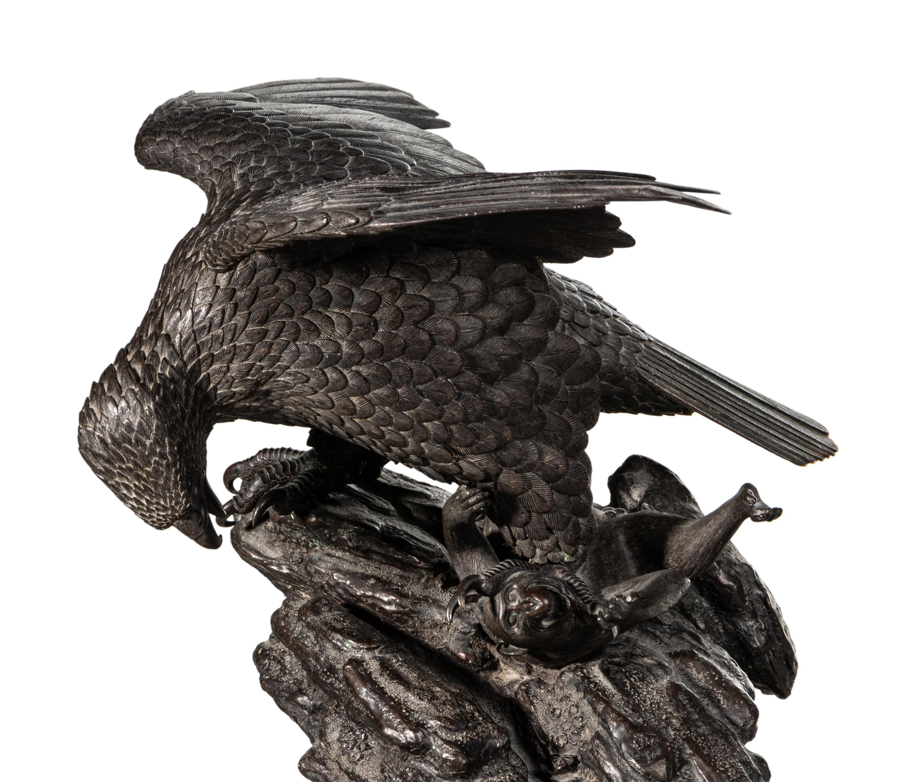 A Japanese Bronze Figural Group of a Hawk Hunting Monkeys