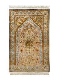 A Hereke Silk Prayer Rug — 20TH CENTURY