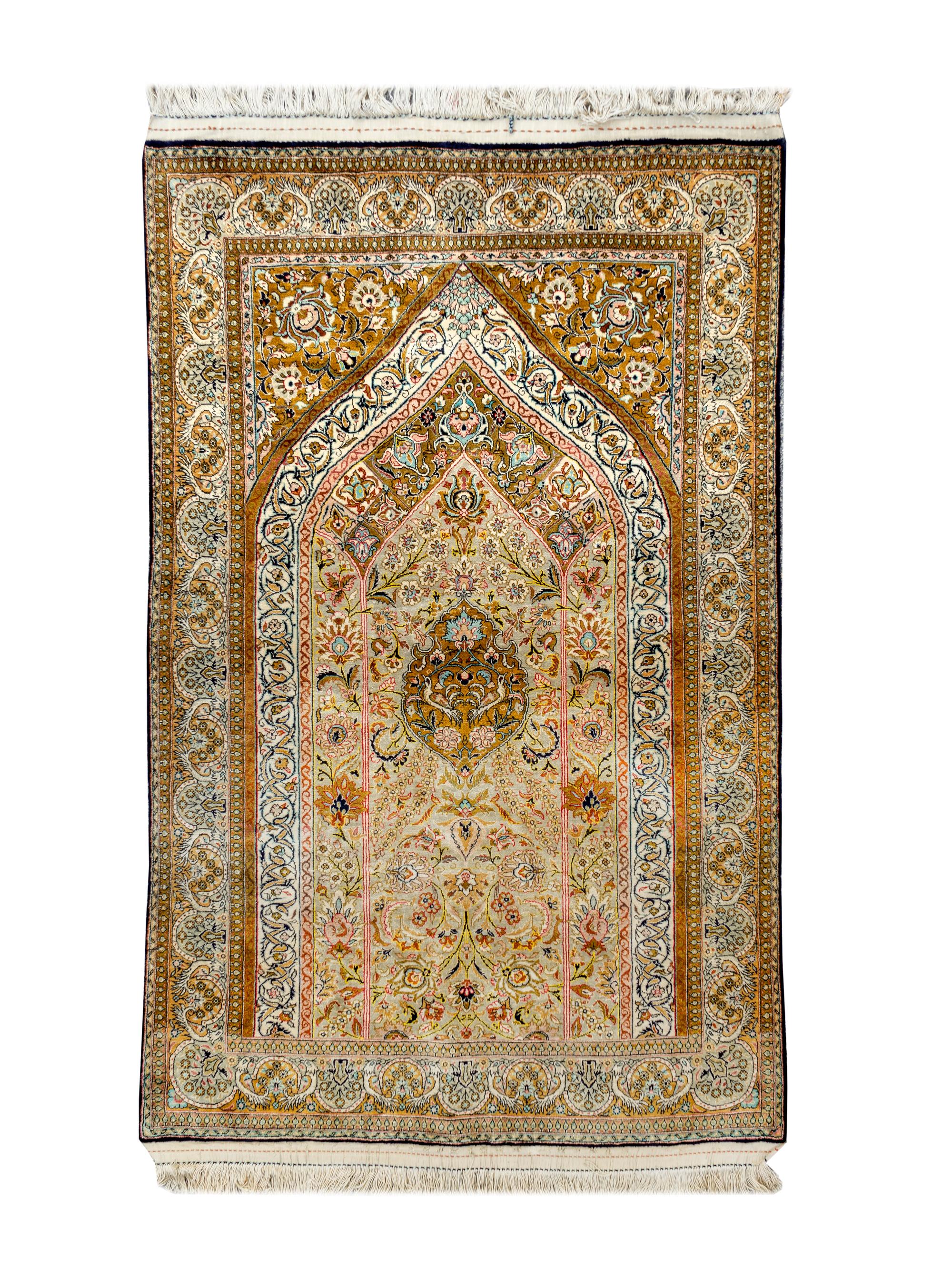 A Hereke Silk Prayer Rug — 20TH CENTURY