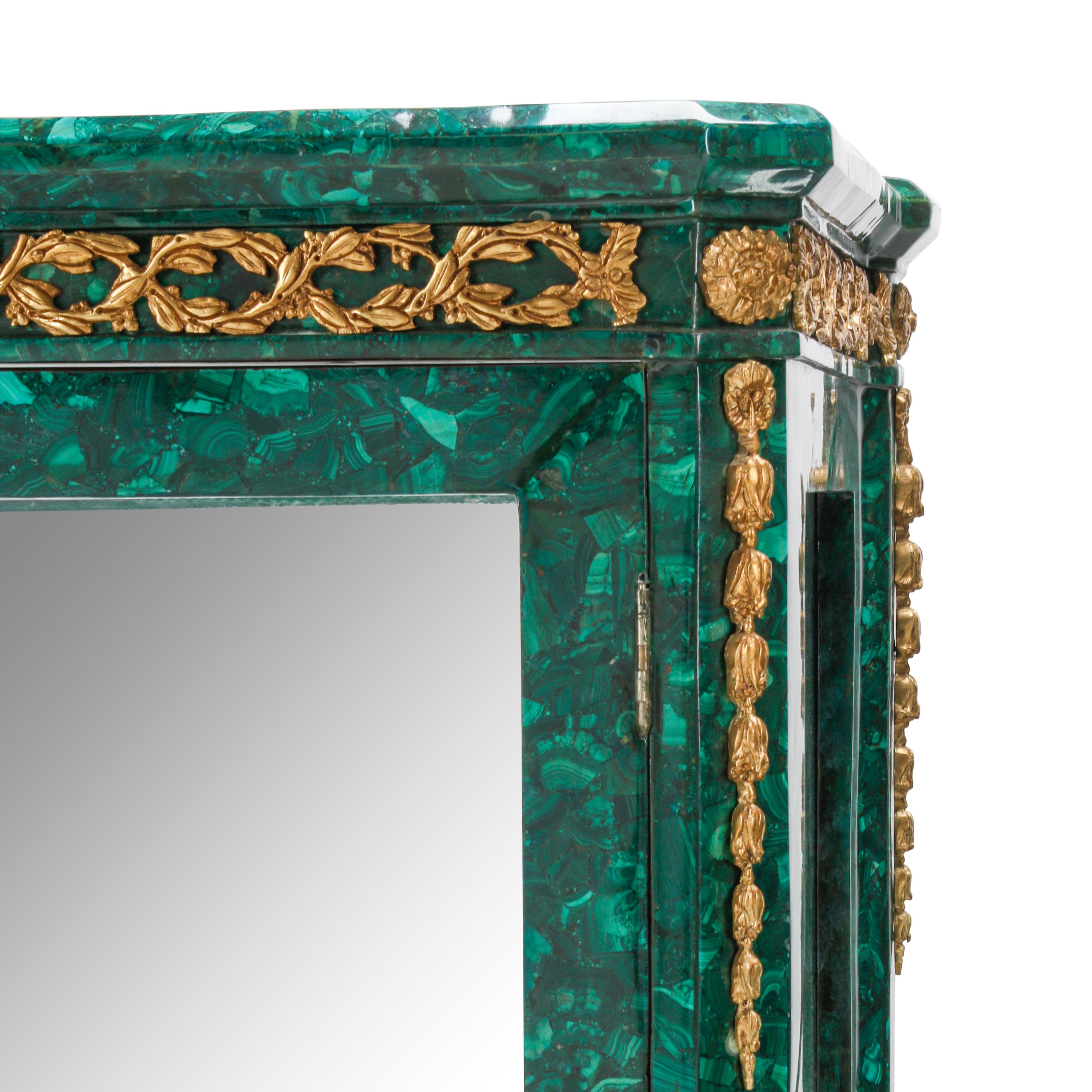 A Pair of Louis XVI Style Malachite Veneered and Gilt Bronze Mounted Vitrine Cabinets
