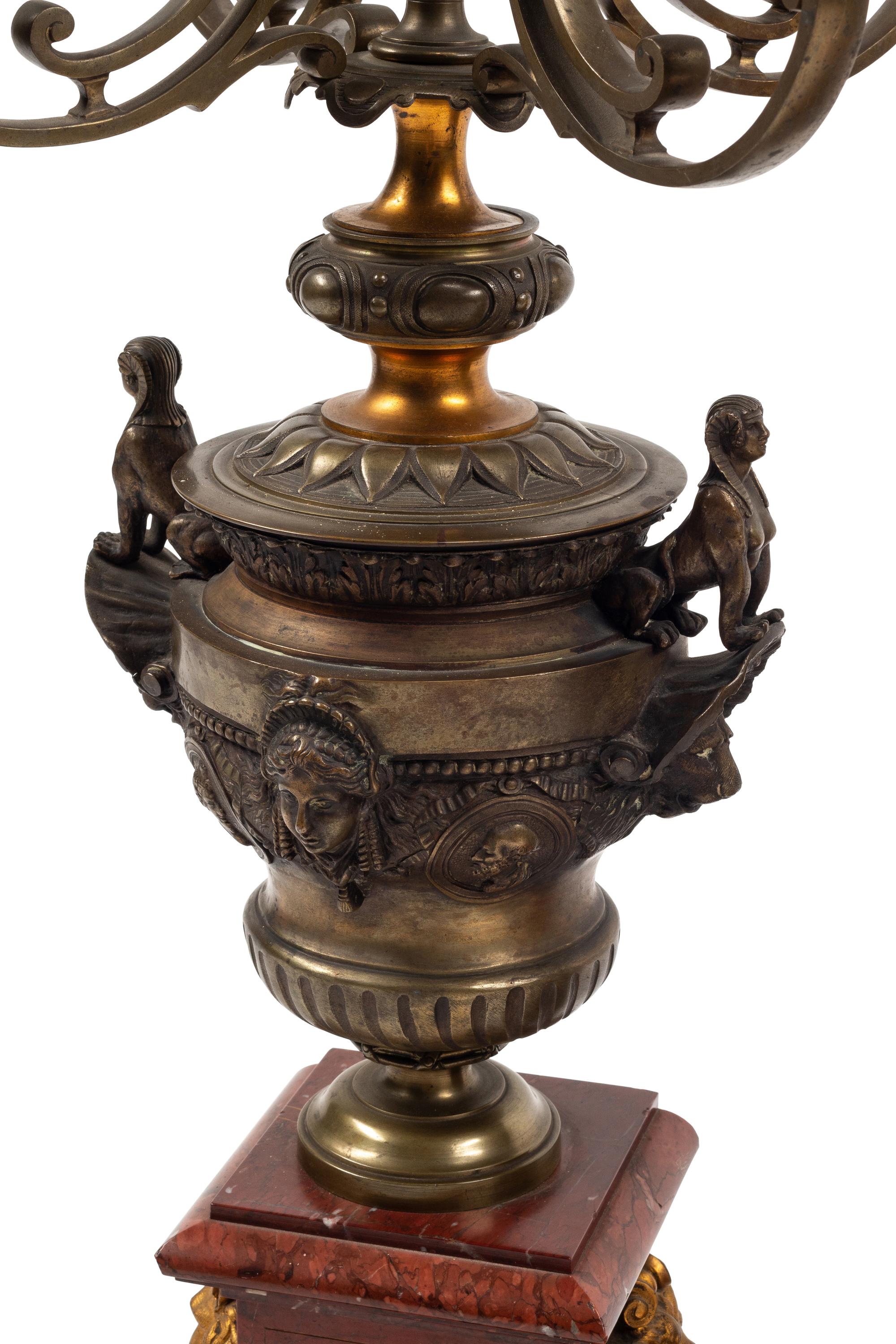 A Monumental French Neoclassical Gilt Bronze and Rouge Marble Clock Garniture
