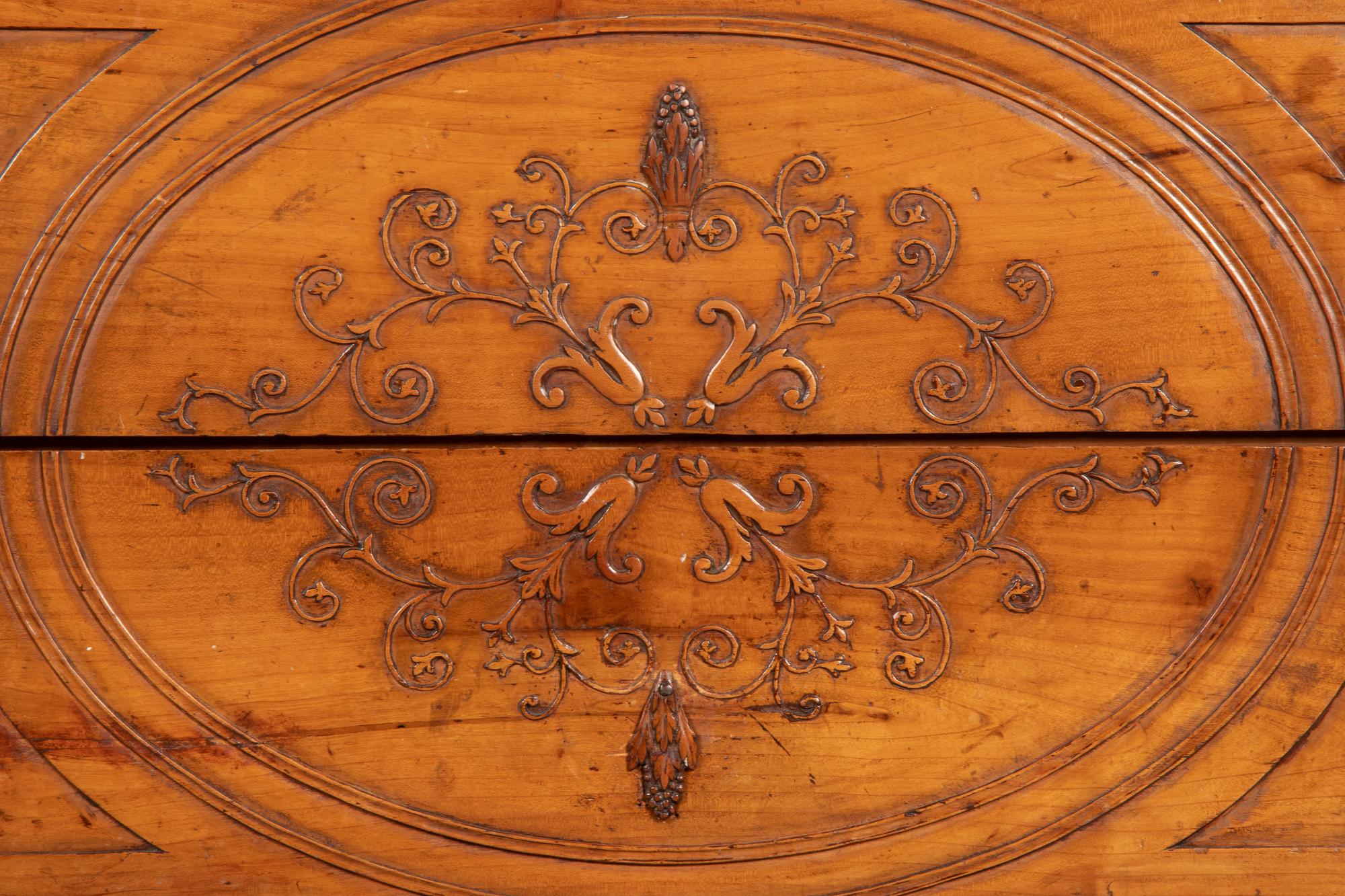 An Italian Carved Fruitwood Marble-Top Commode