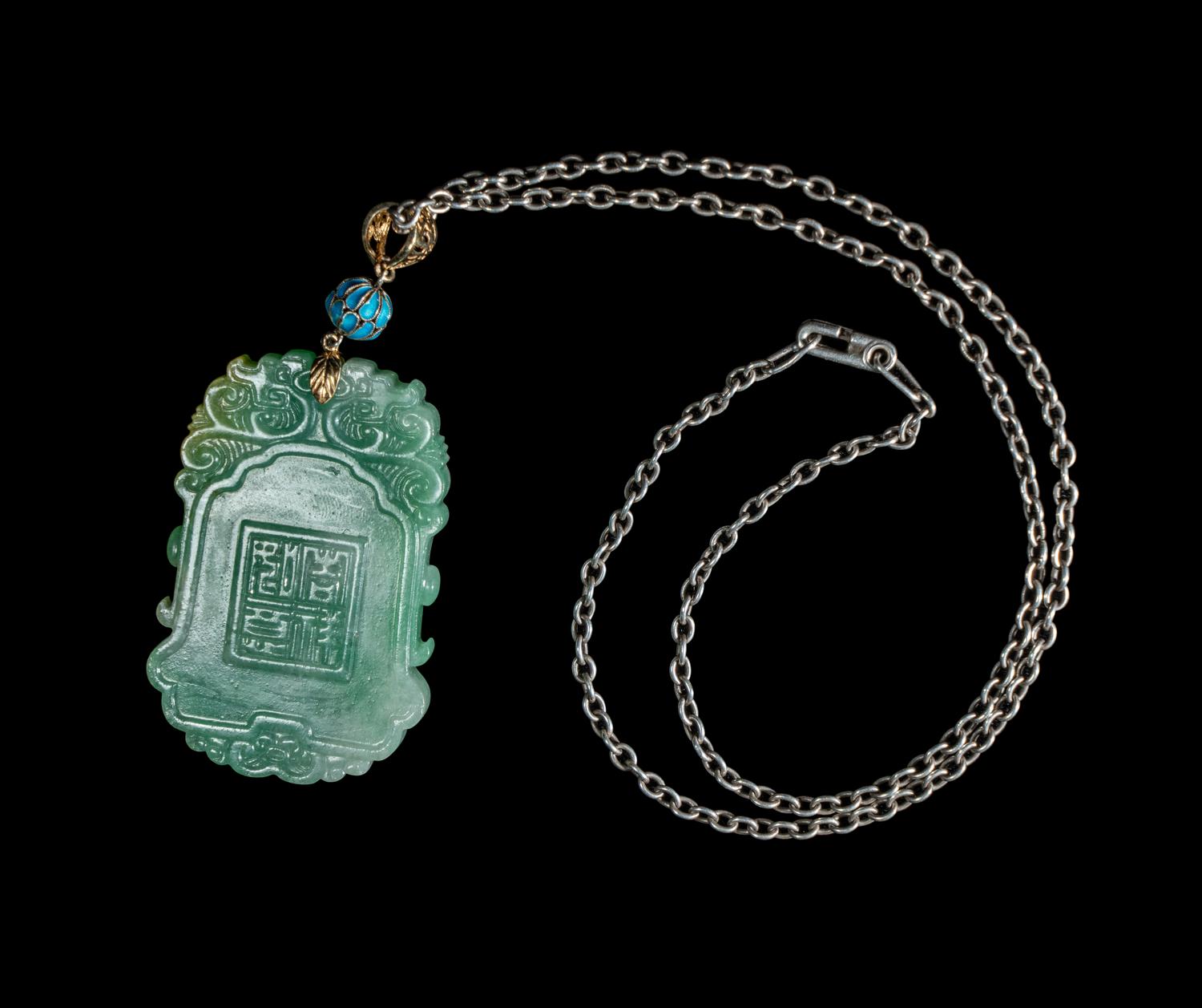 A Fine Chinese Semi-Translucent Green Jadeite Pendant