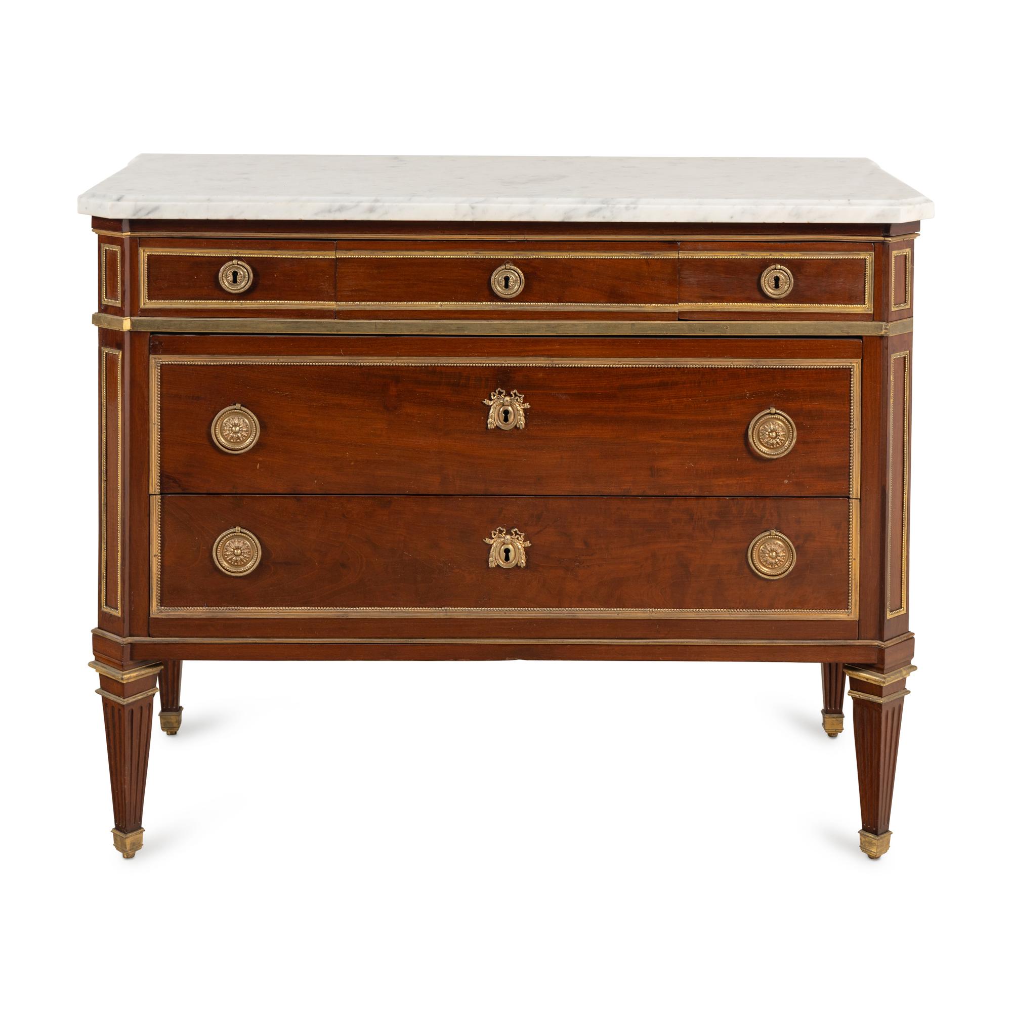 A Louis XVI Gilt Bronze-Mounted Mahogany Marble-Top Commode