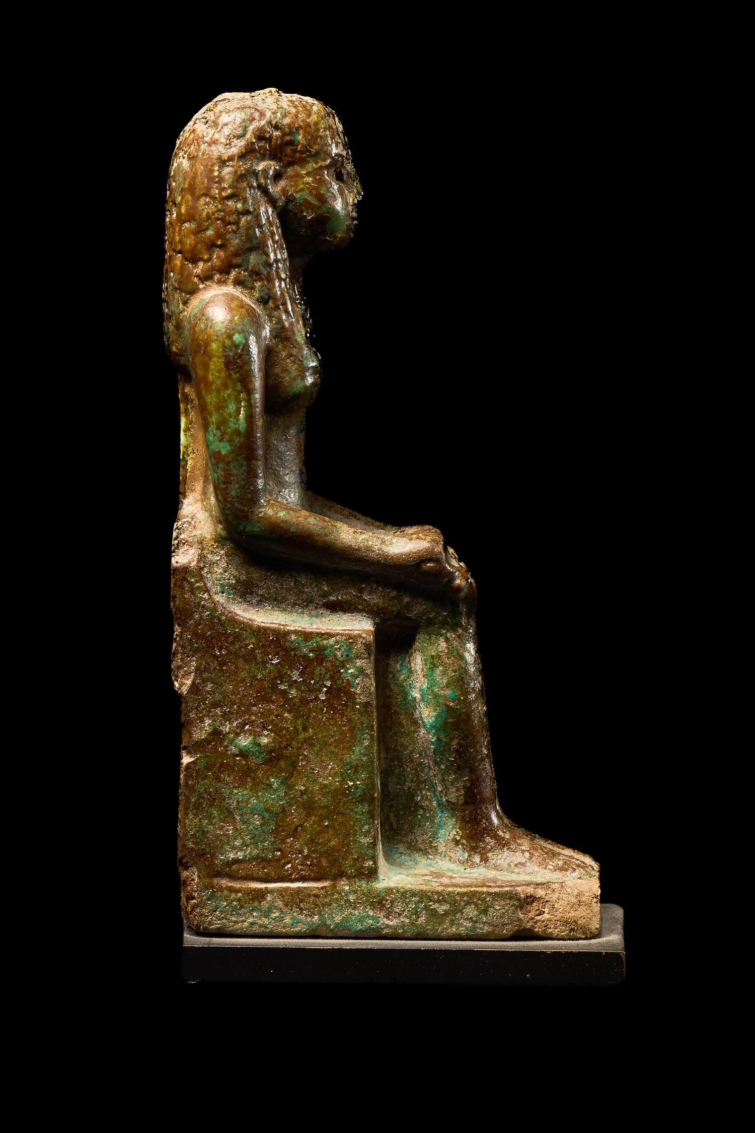 An Egyptian Faience Enthroned Queen or Goddess