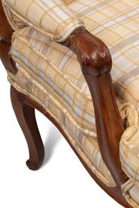 A Pair of Louis XV Provincial Walnut Fauteuils