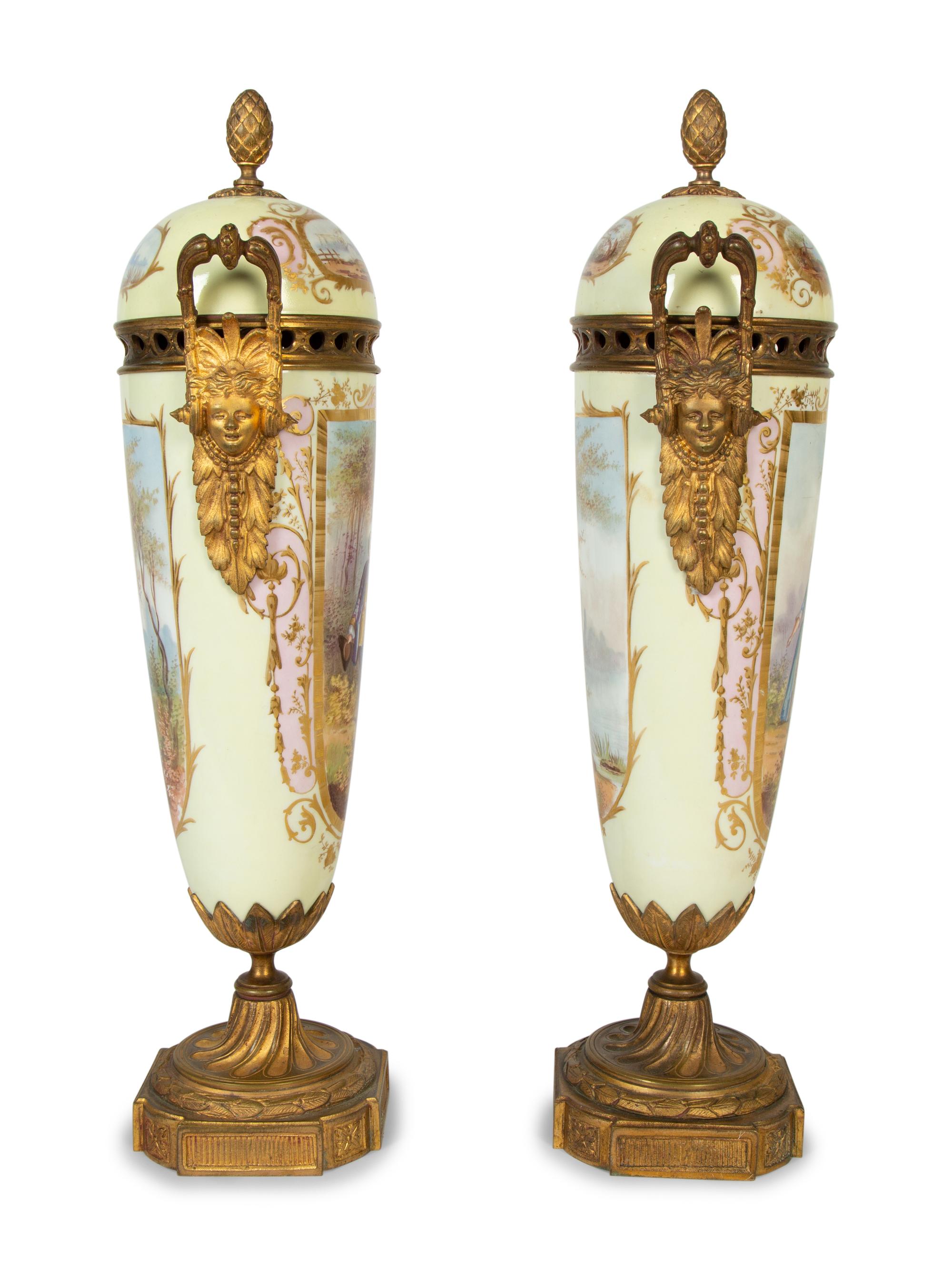 A Pair of Gilt Bronze Mounted Sèvres Style Porcelain Urns