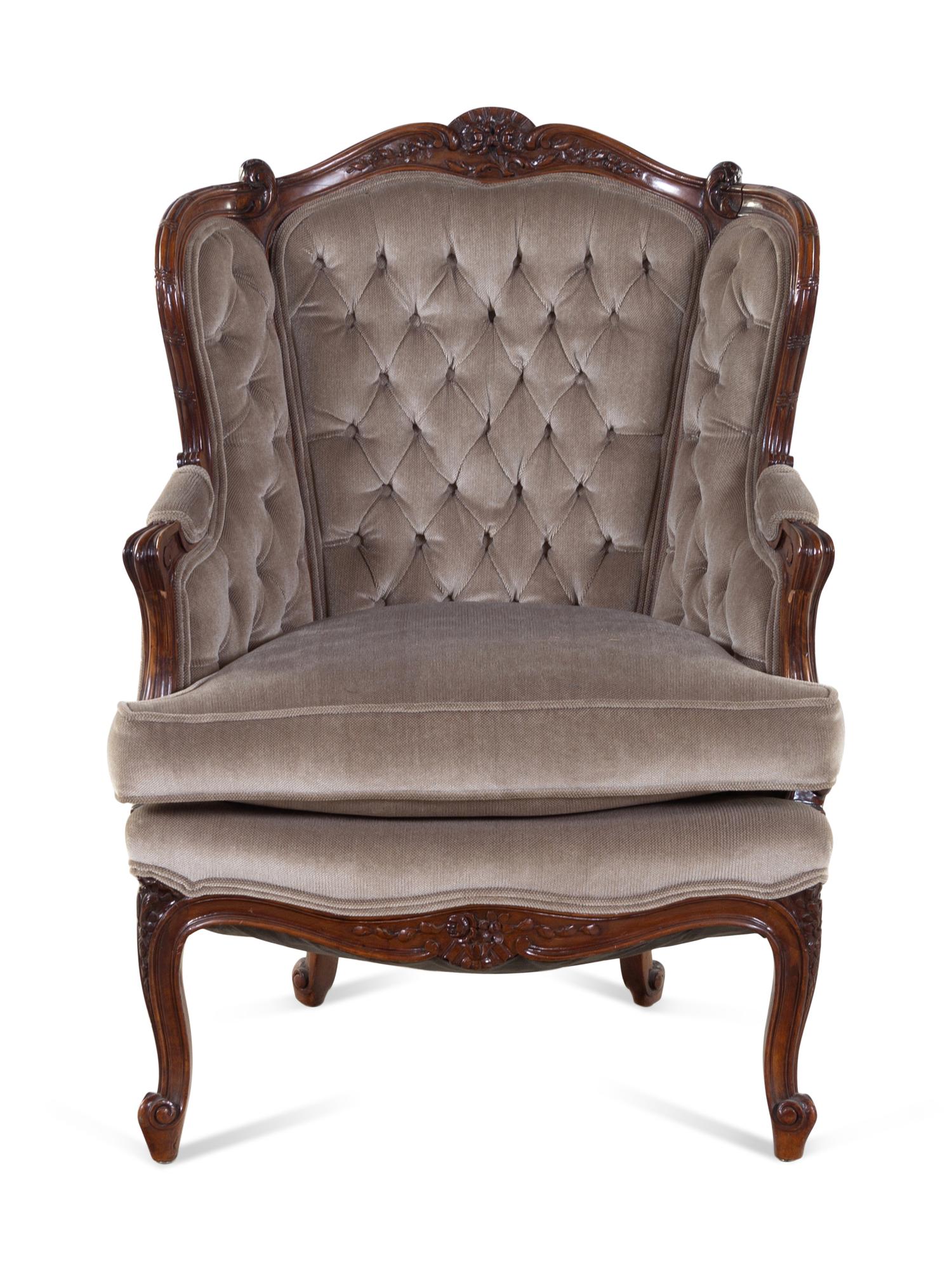 A Louis XV Style Carved Walnut Bergère
