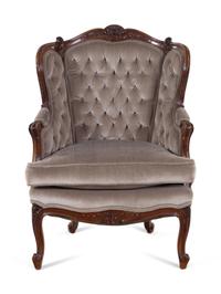 A Louis XV Style Carved Walnut Bergère