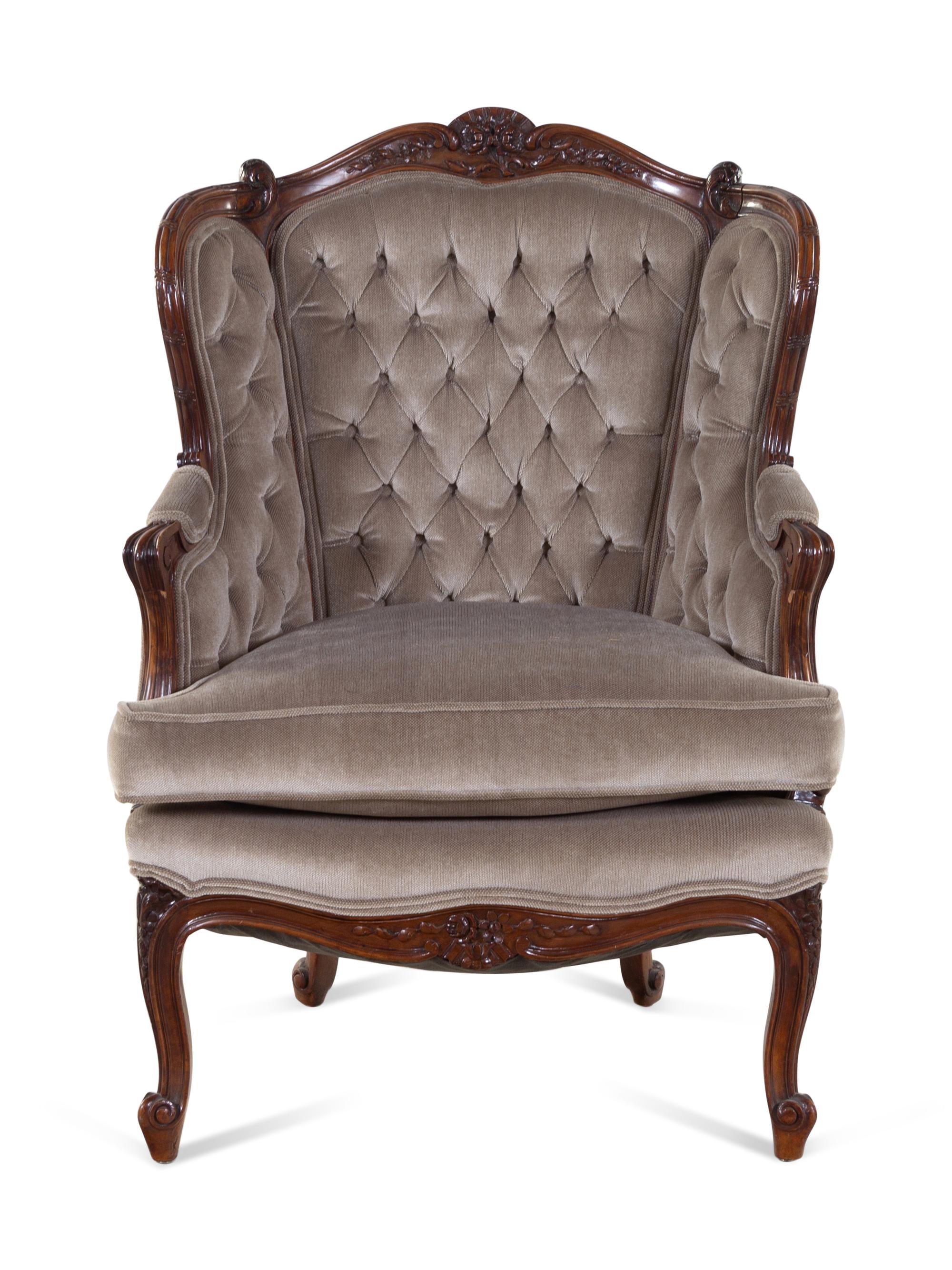A Louis XV Style Carved Walnut Bergère
