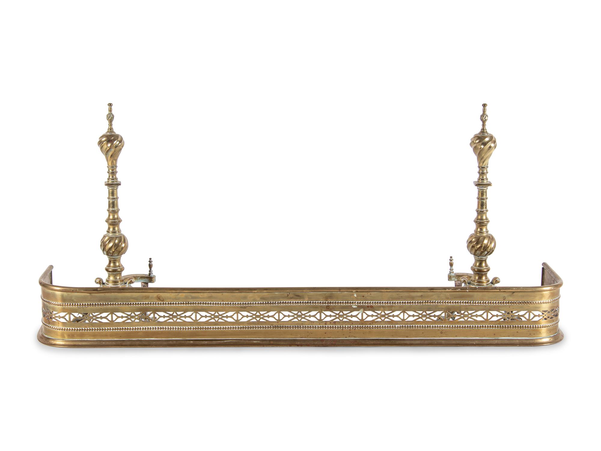 A Baroque Revival Brass Fireplace Suite