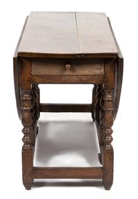 An English Oak Gate Leg Table Height 29 1/2 x width 52 x depth 21 inches (closed).