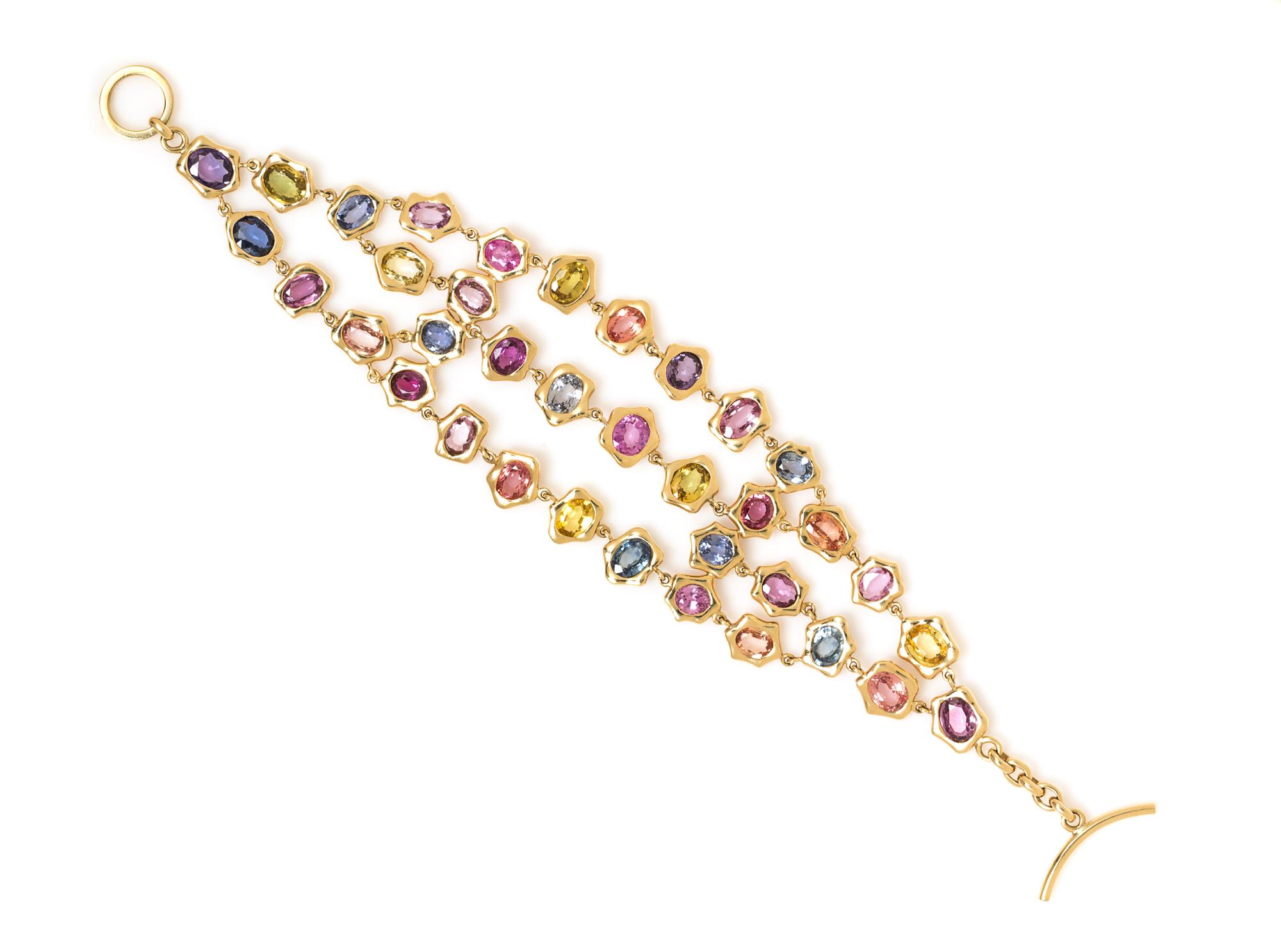 An 18 Karat Yellow Gold and Multicolor Sapphire Bracelet, 26.20 dwts.