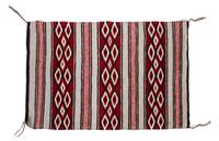 A Navajo Yei Rug First: 33 x 21 inches.