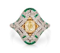 A Platinum, Yellow Gold, Fancy Yellow Diamond, Diamond and Emerald Ring, 4.00 dwts.