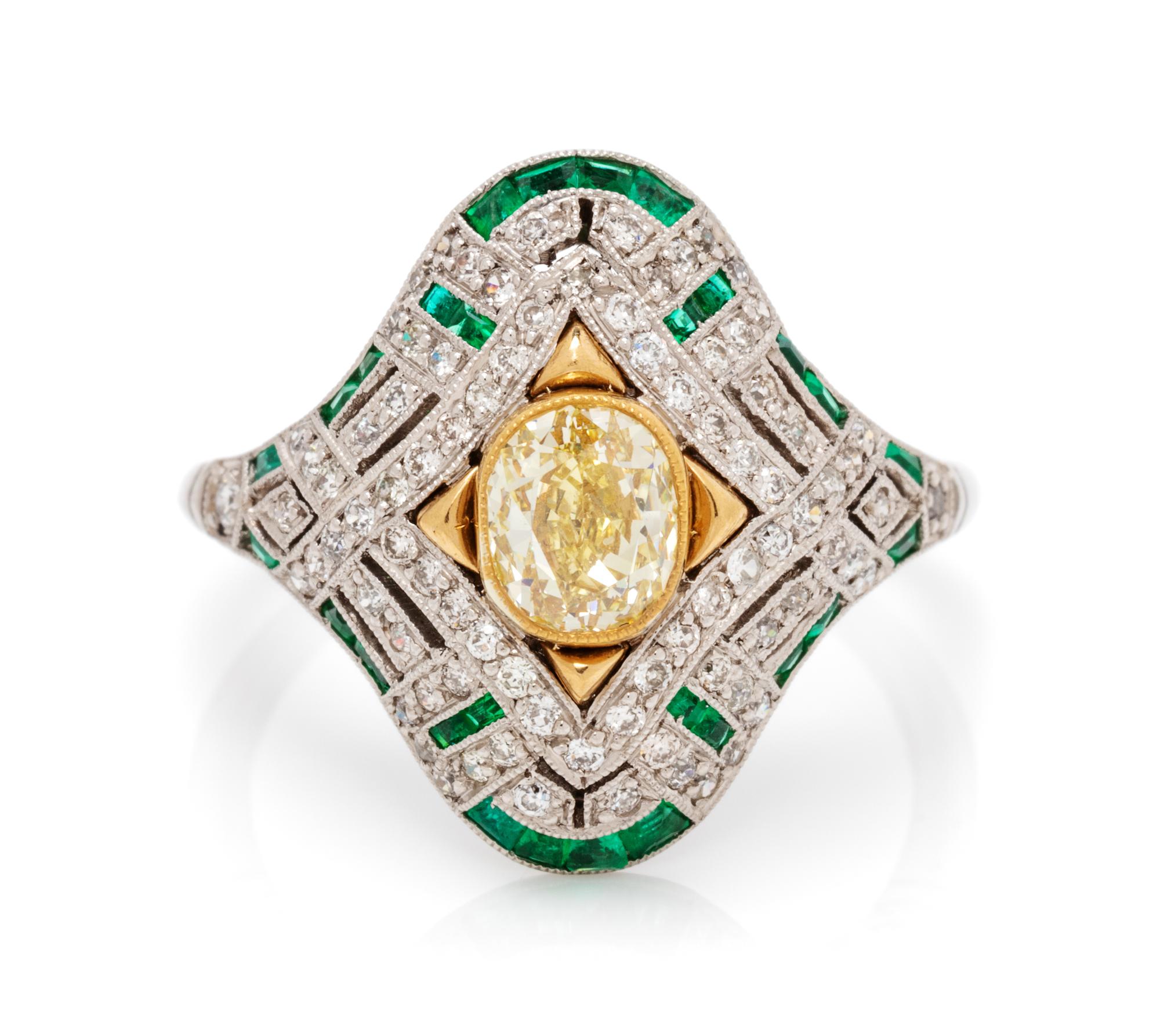 A Platinum, Yellow Gold, Fancy Yellow Diamond, Diamond and Emerald Ring, 4.00 dwts.