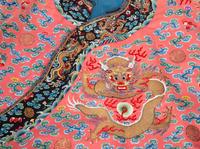 A Chinese Embroidered Pink Silk Dragon Robe