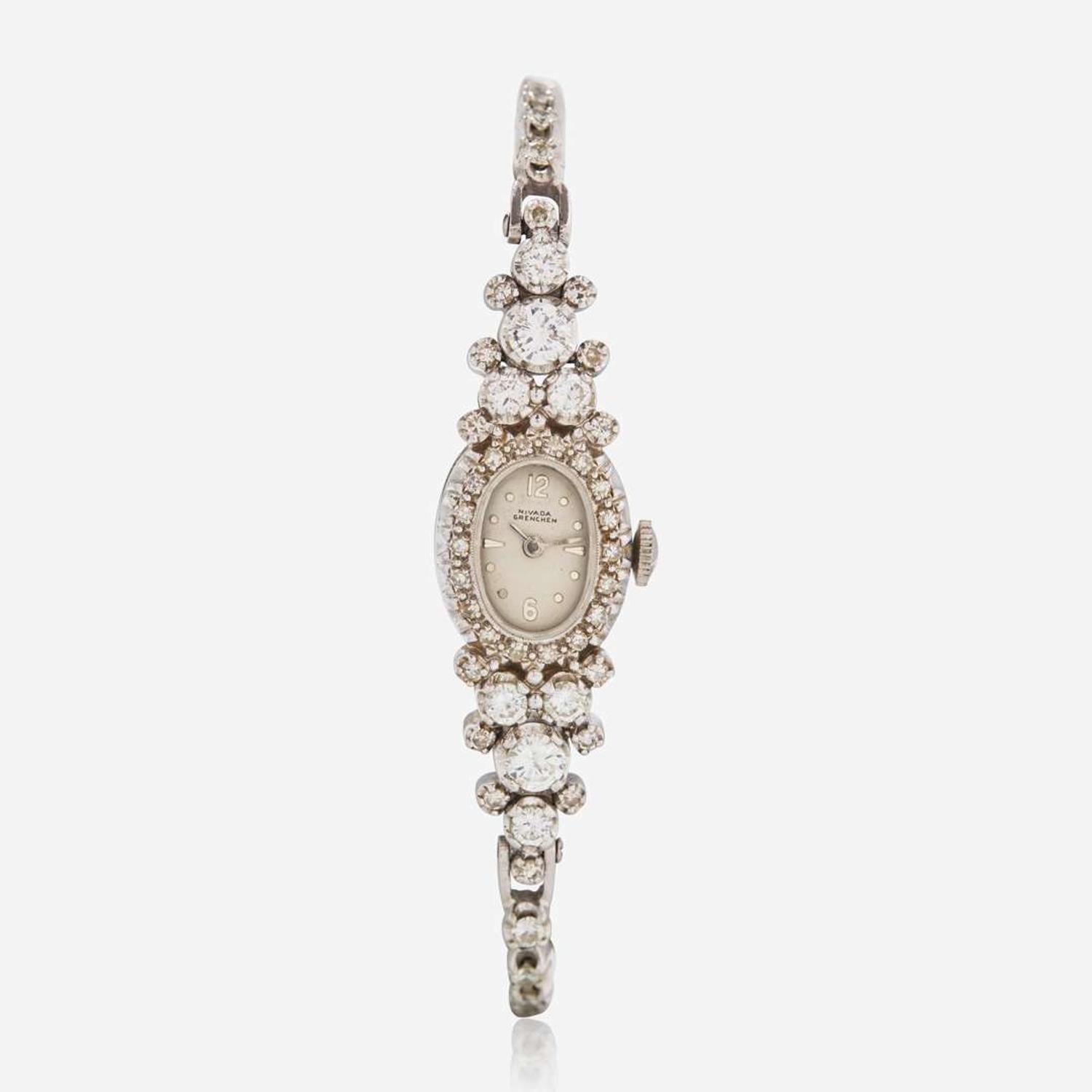 A 14K White Gold and Diamond Bracelet Watch