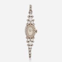 A 14K White Gold and Diamond Bracelet Watch