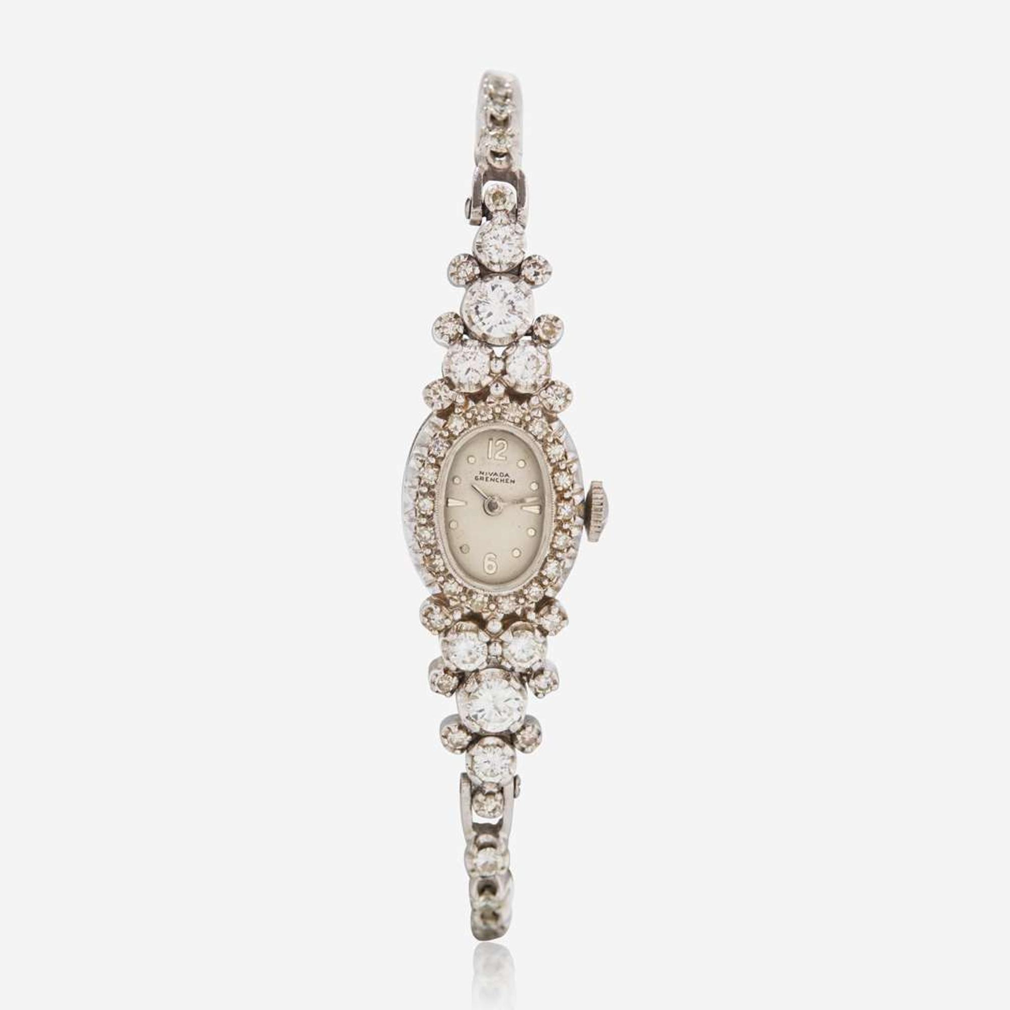 A 14K White Gold and Diamond Bracelet Watch