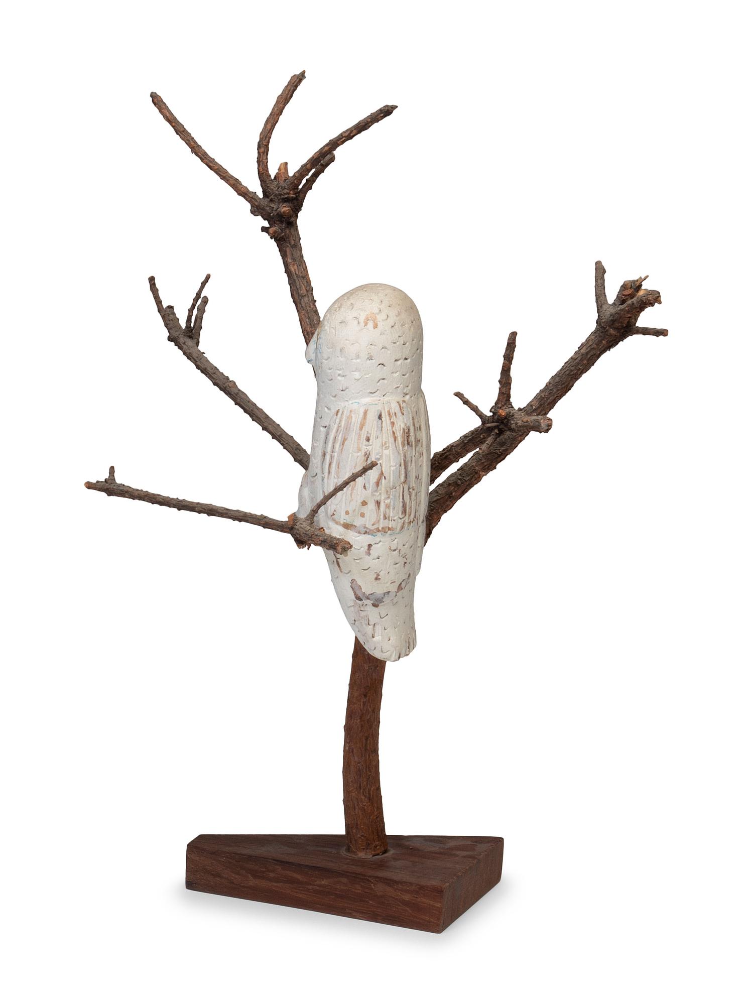 A Folk Art Carving of a Snowy Owl Perched in Tree