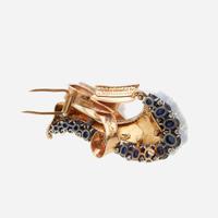 A Retro sapphire, diamond, and fourteen karat gold brooch circa 1940s