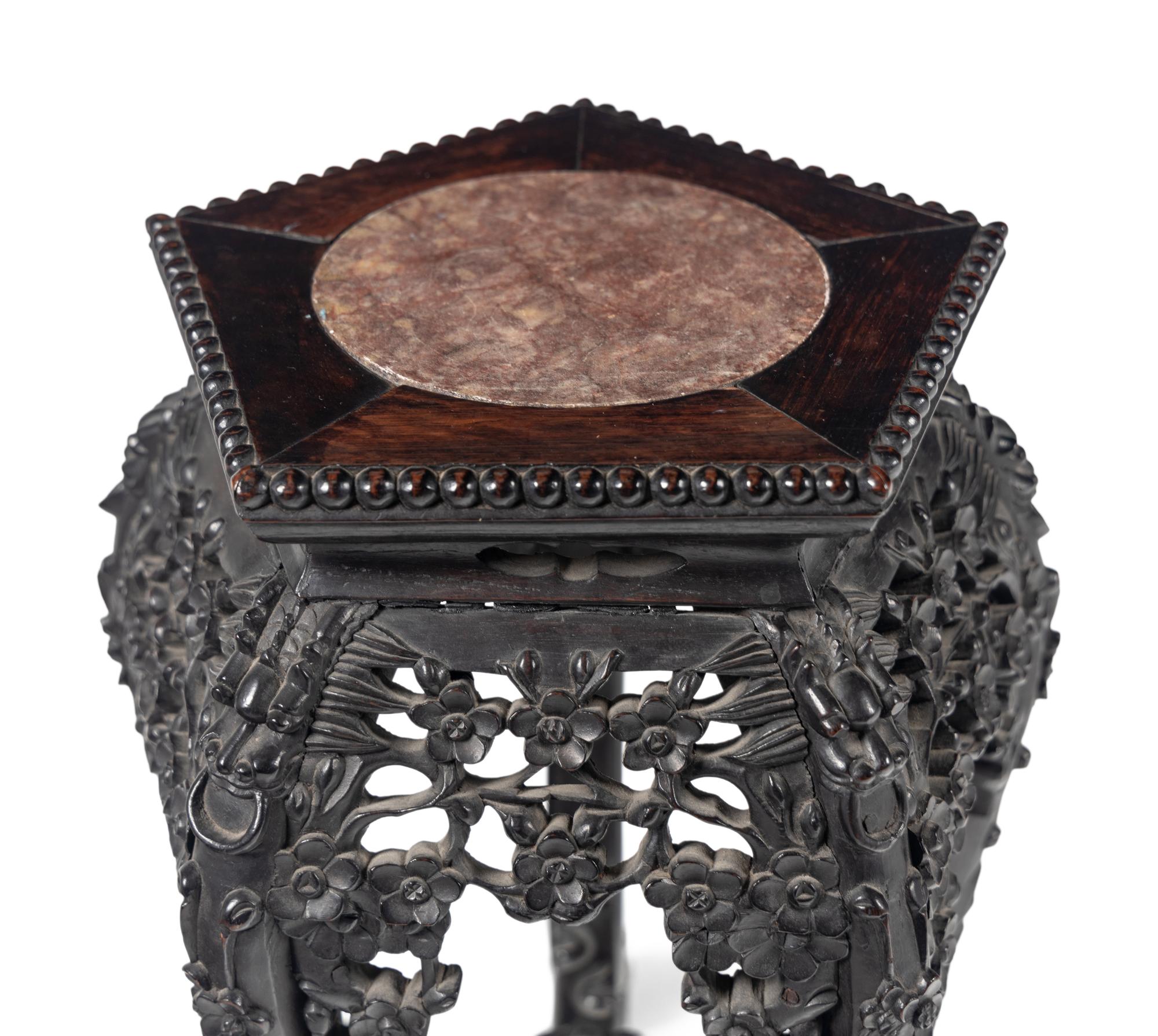 A Chinese Export Carved Hardwood Stand
