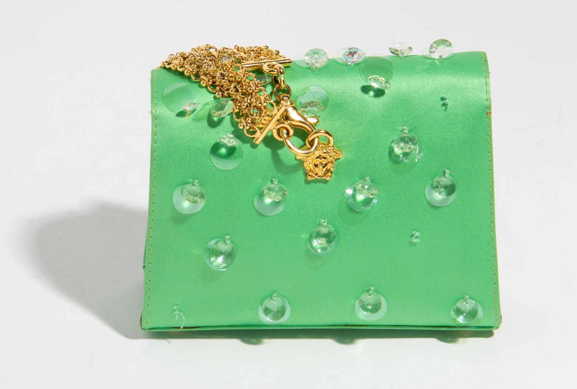 A Gianni Versace Green Silk Wristlet, 5.75" x 4" x 2"; Bracelet: 10" x .75".