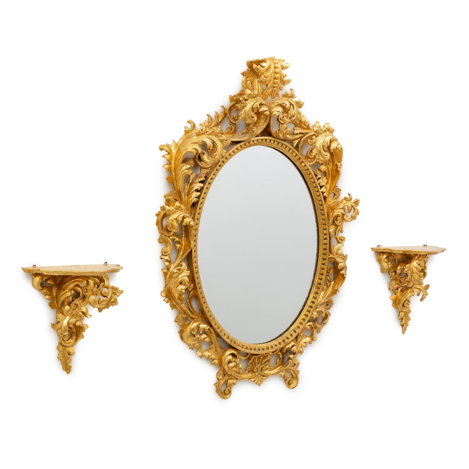 An Italian Rococo Style Carved Giltwood Oval Mirror and a Pair of Wall Brackets
