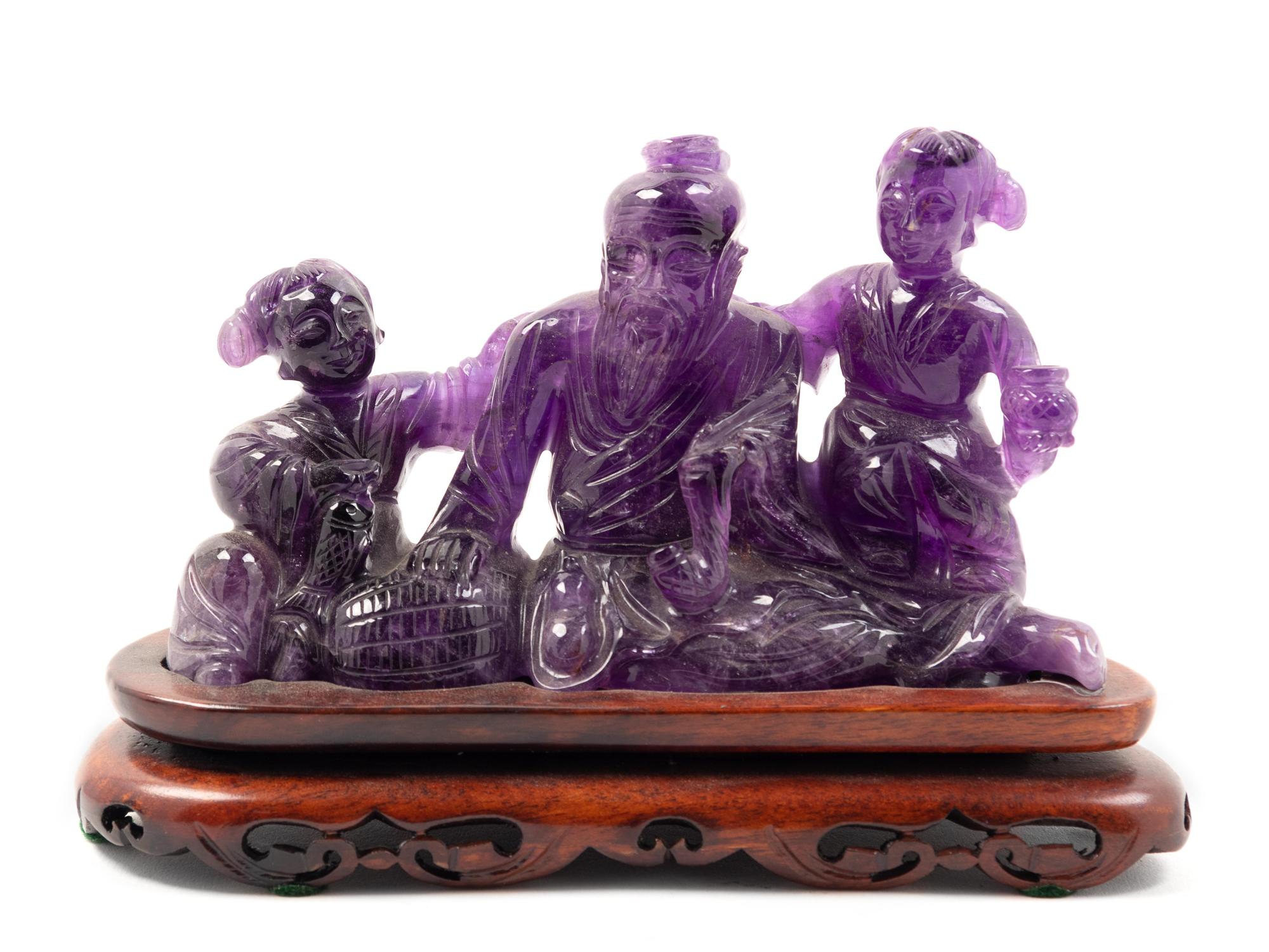 Two Chinese Amethyst Figural Groups