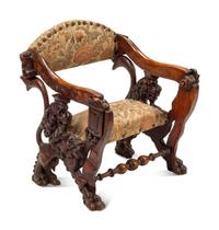 An Italian Carved Walnut Low Armchair