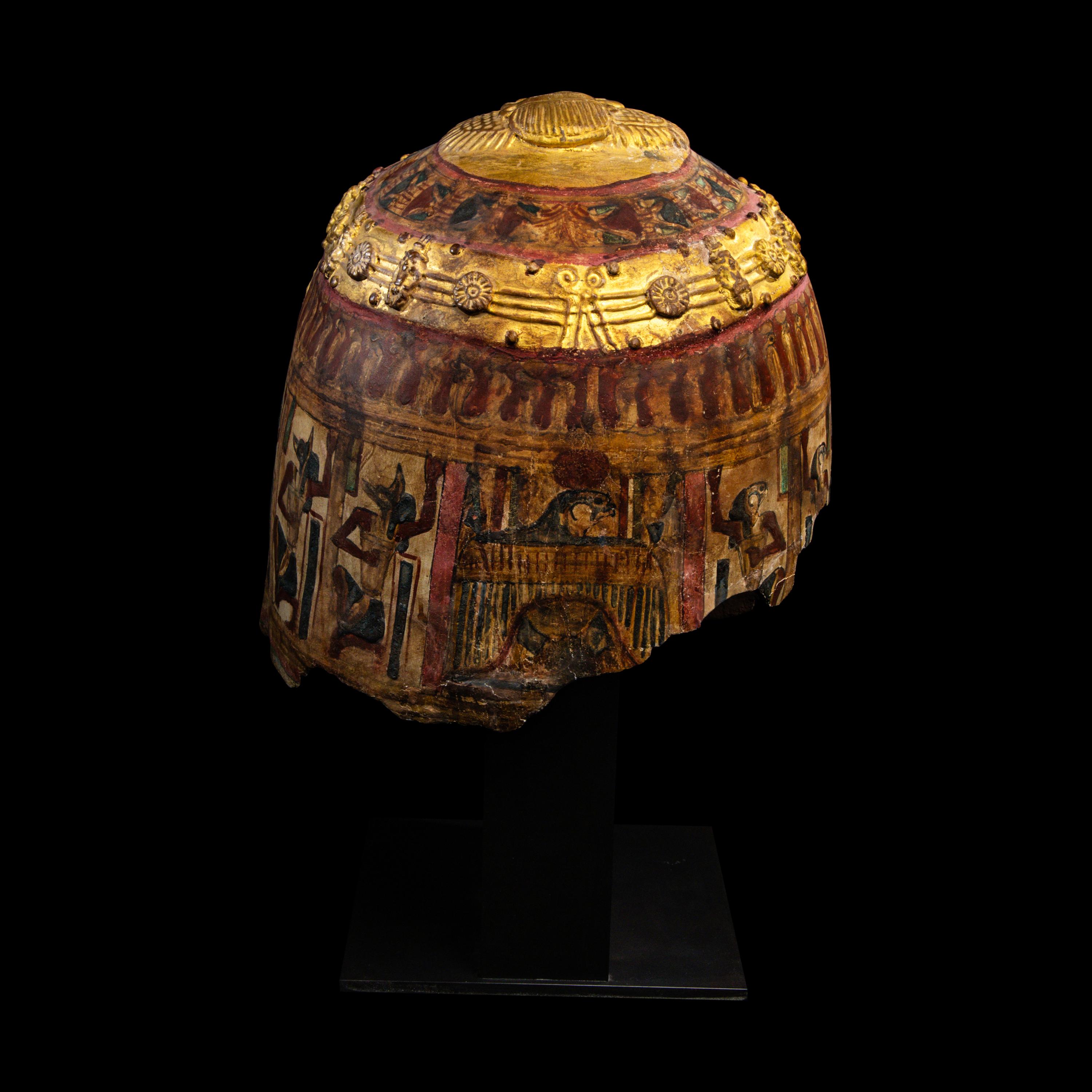 An Egyptian Gilt Cartonnage Mummy Mask of a Woman